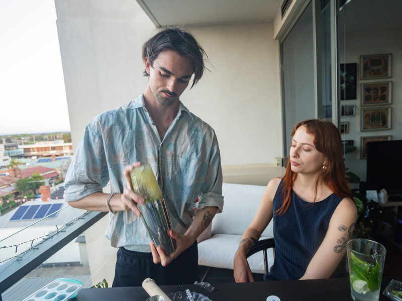 couples making cocktails at home